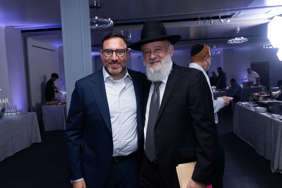 Two attendees at the Yeshiva Pe'er HaTorah Annual Rooftop Benefit